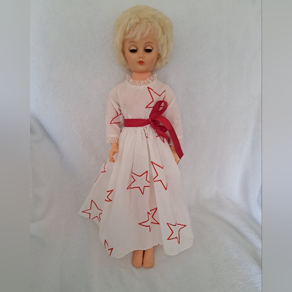 Vintage Doll With A Handmade Dress.